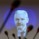 WikiLeaks founder Julian Assange is seen on a screen speaking via webcast from the Ecuadorian Embassy in London during a United Nations refugees agency event March 23, 2015, in Geneva.
FABRICE COFFRINI/AFP/Getty Images